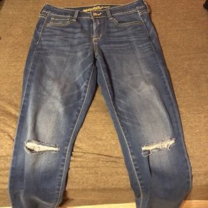 Light blue jeans. Slit in knee